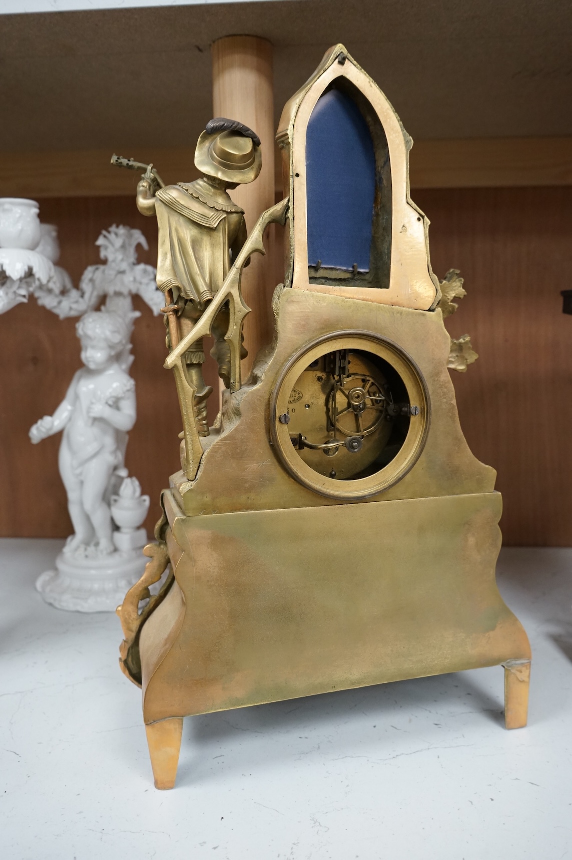 A late 19th century French gilt bronze mantel clock, with figural surmount, 42.5cm high.